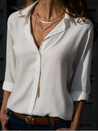 Women's solid color long sleeved button up shirt